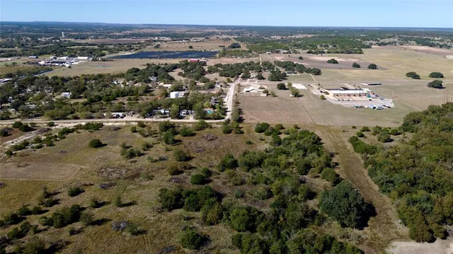 an aerial view of a houses with a outdoor space