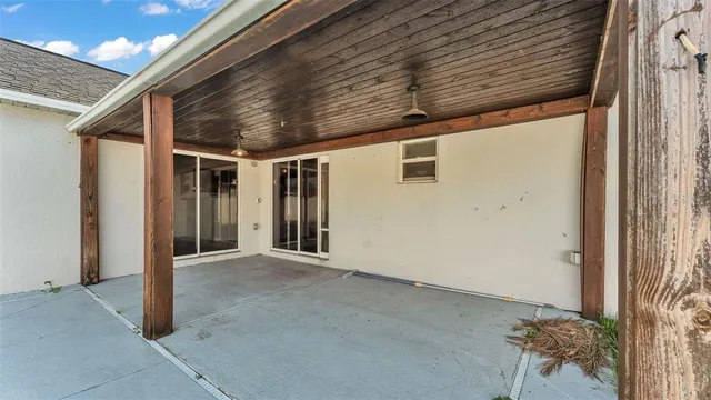 a view of a house with pool and a yard