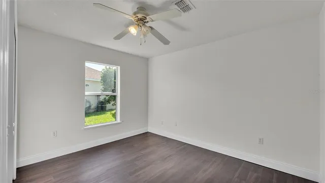 an aerial view of a house with a garden and swimming pool