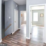 4012 Boarman Avenue Baltimore, MD 21215 - Photo 11 of 43 a view of a hallway with wooden floor
