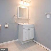 4012 Boarman Avenue Baltimore, MD 21215 - Photo 21 of 43 a bathroom with a sink a vanity and a mirror