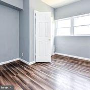 4012 Boarman Avenue Baltimore, MD 21215 - Photo 26 of 43 a view of wooden floor and windows in a room