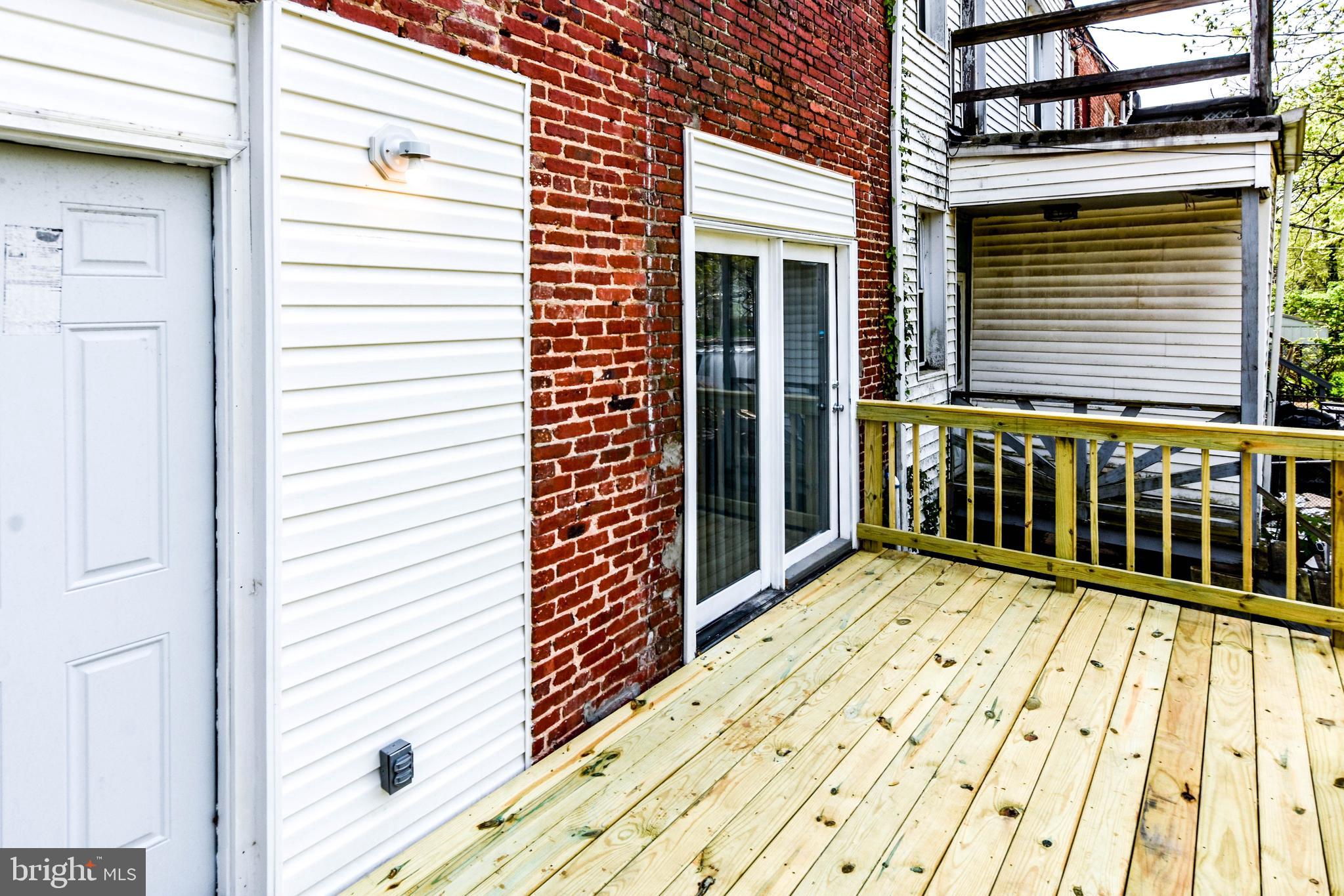 4012 Boarman Avenue Baltimore, MD 21215 - Photo 40 of 43 a view of a balcony with wooden floor