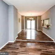 a view of room with window and hardwood floor