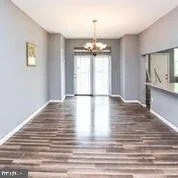 a kitchen with stainless steel appliances a stove top oven and a refrigerator