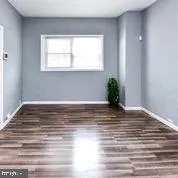 a kitchen with stainless steel appliances a stove microwave and a sink