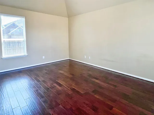 a view of a swimming pool with a table and chairs