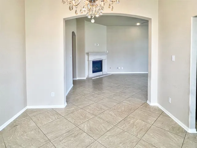 an empty room with windows and entrance