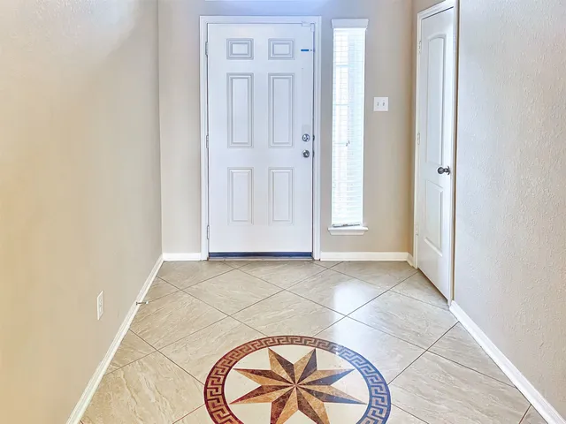a view of an empty room with a fireplace