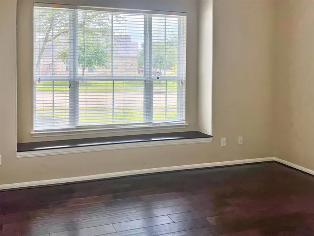a view of a room with a chandelier and window