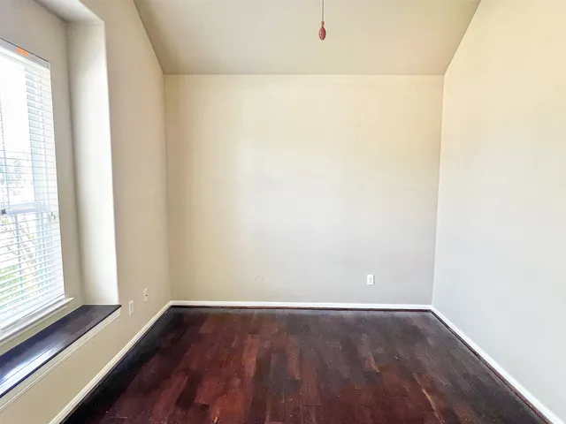 a view of a small space with wooden floor