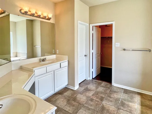 a swimming pool with some trees in the background