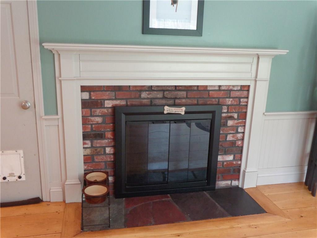 694 Chick Crossing Road Wells, ME 04090 - Photo 9 of 25 Fireplace in kitchen ---- dining area.