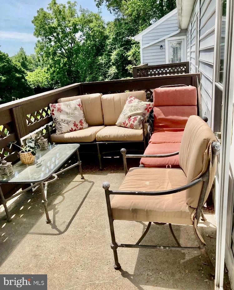 10087 Oakton Terrace Road Oakton, VA 22124 - Photo 12 of 13 a backyard of a house with table and chairs