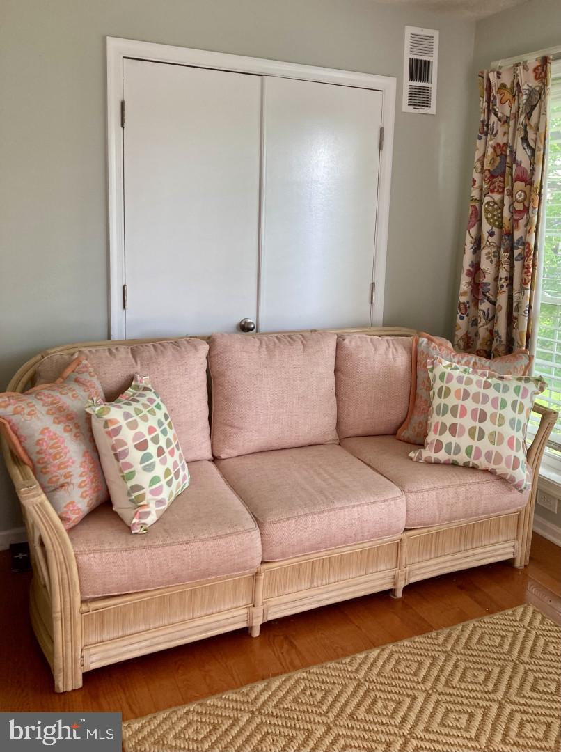 10087 Oakton Terrace Road Oakton, VA 22124 - Photo 7 of 13 a living room with a couch and a walk in closet