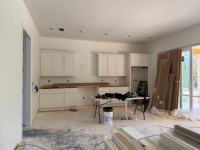 582 Tulip Tree Way Niceville, FL 32578 - Photo 4 of 8 a kitchen with a sink cabinets and refrigerator