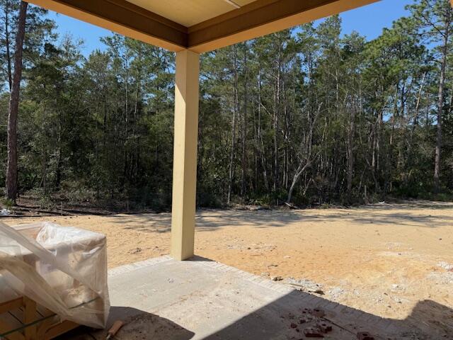 582 Tulip Tree Way Niceville, FL 32578 - Photo 7 of 8 a view of a backyard of the house