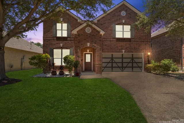 a front view of a house with a yard