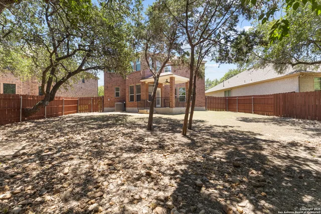 a backyard of a house with lots of green space