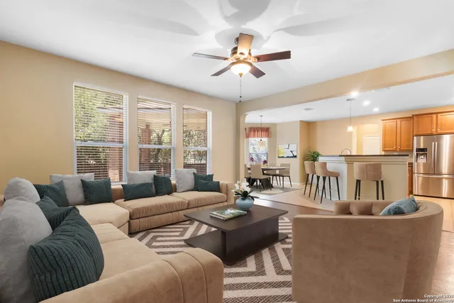 a living room with furniture and a large window