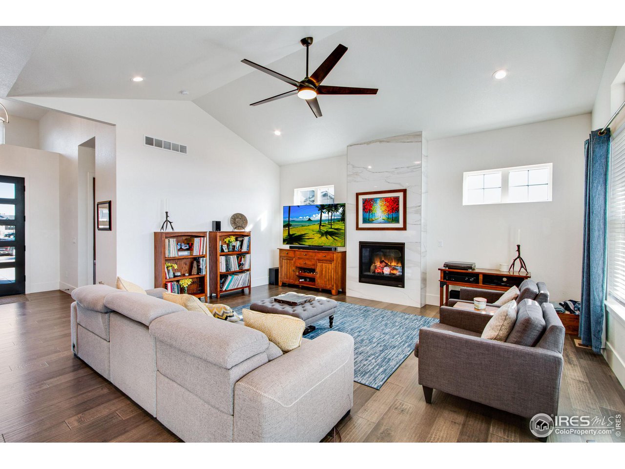 6278 Foundry Court Timnath, CO 80547 - Photo 21 of 40 a living room with furniture and kitchen view