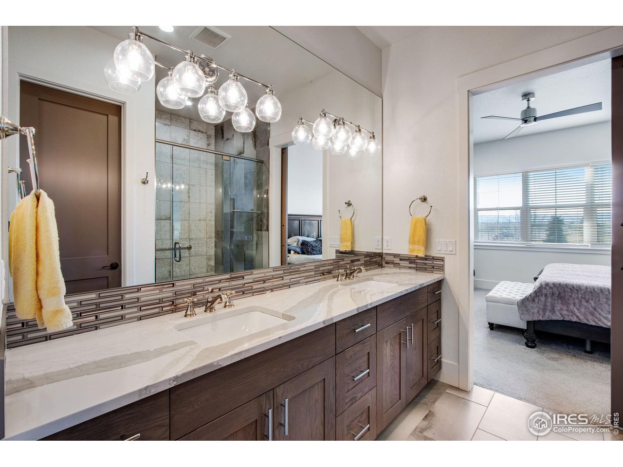 6278 Foundry Court Timnath, CO 80547 - Photo 24 of 40 a bathroom with a sink double vanity and a mirror