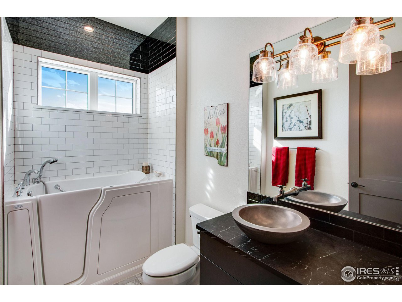 6278 Foundry Court Timnath, CO 80547 - Photo 27 of 40 a bathroom with a sink and a mirror