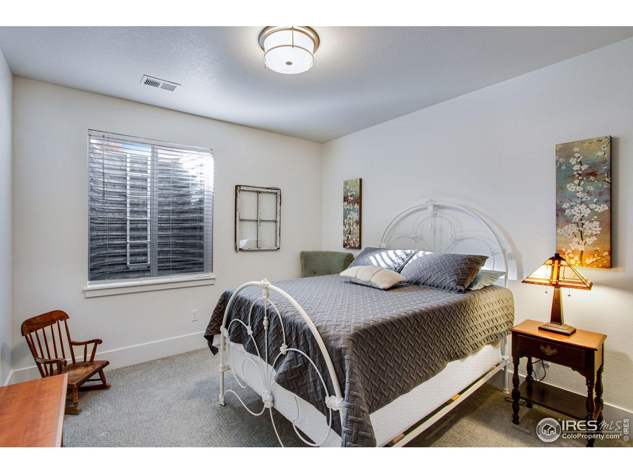6278 Foundry Court Timnath, CO 80547 - Photo 33 of 40 a bedroom with a bed a couch and dresser