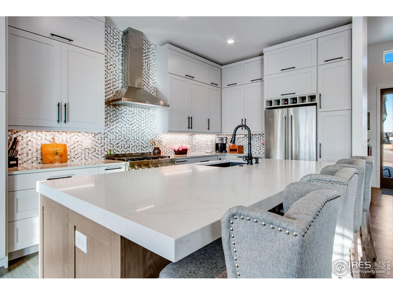 6278 Foundry Court Timnath, CO 80547 - Photo 10 of 40 a kitchen with a refrigerator sink and cabinets