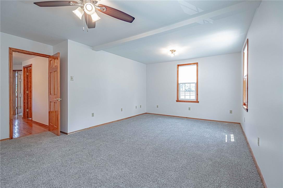 4165 East Texas Road Allentown, PA 18103 - Photo 34 of 56 A spacious room with soft carpeting offers abundant natural light and a comforting ceiling fan.