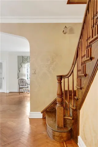 a view of entryway and hall with wooden floor