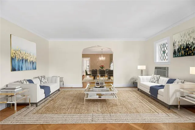 a living room with furniture and a mirror