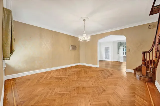 a view of an empty room with glass door