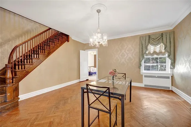 a dining room with furniture and window