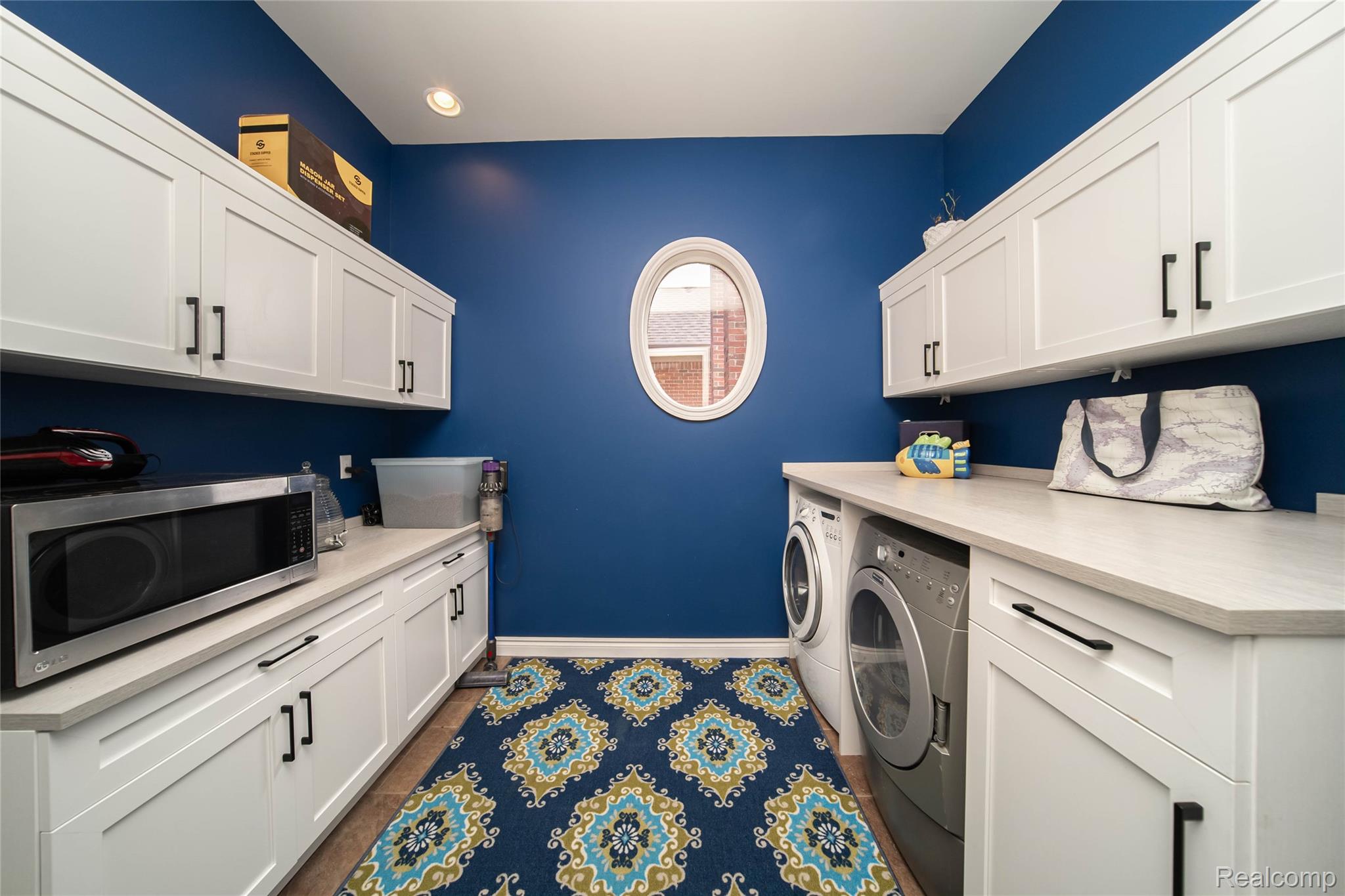 67102 Rachael Lane Washington, MI 48095 - Photo 23 of 37 Laundry room with independent washer and dryer and cabinet space