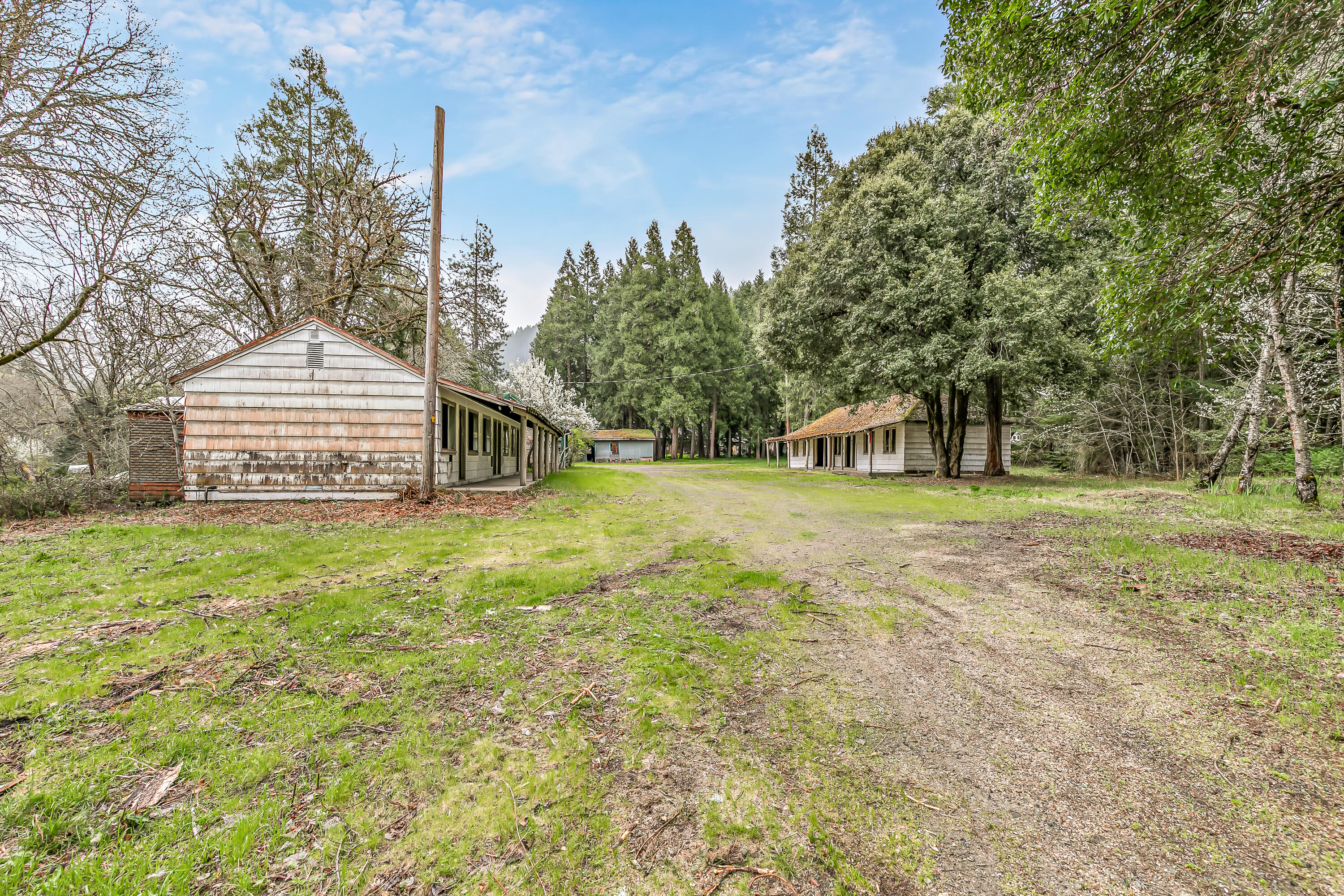 159 Bloom Road Wolf Creek, OR 97497 - Photo 24 of 38 a front view of a house with a yard