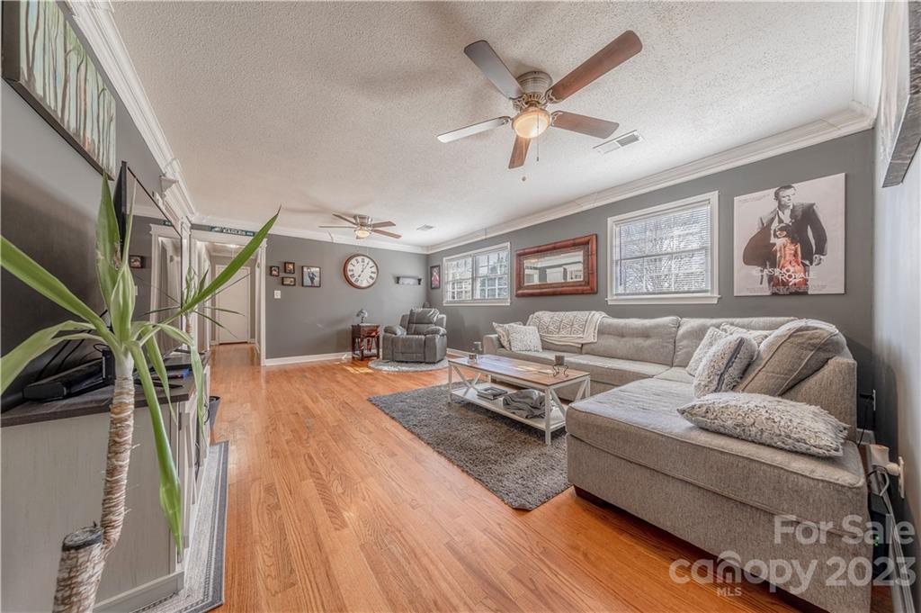10672 Barberville Road Indian Land, SC 29707 - Photo 5 of 22 a living room with furniture and wooden floor