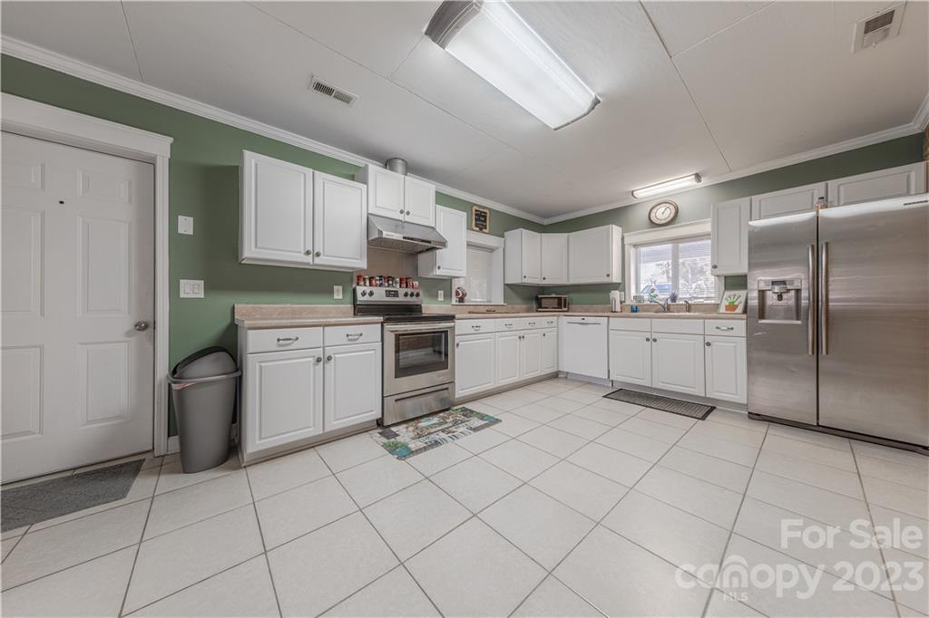 10672 Barberville Road Indian Land, SC 29707 - Photo 9 of 22 a kitchen with cabinets and stainless steel appliances