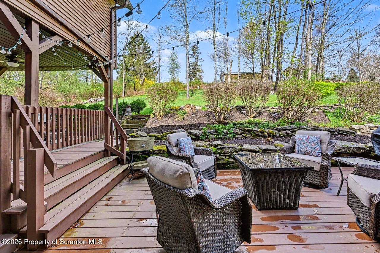 719 Scott Road Clarks Summit, PA 18411 - Photo 42 of 51 a view of a patio with table and chairs and potted plants