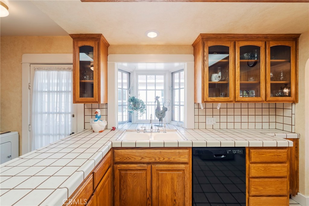 405 North Janss Street Anaheim, CA 92805 - Photo 12 of 33 a kitchen with a sink stove and cabinets