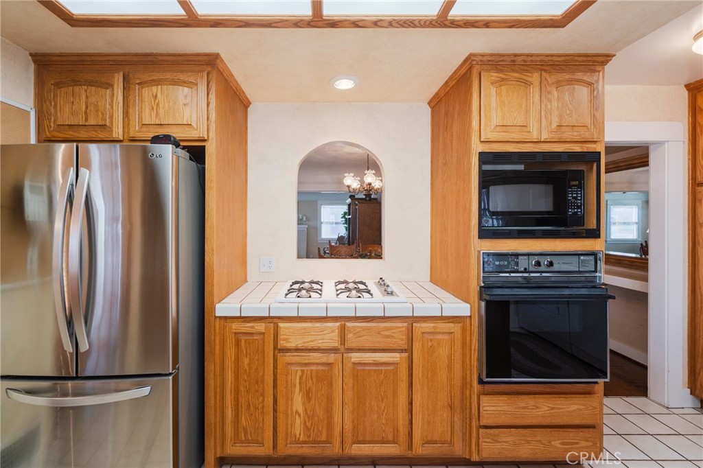 405 North Janss Street Anaheim, CA 92805 - Photo 14 of 33 a kitchen with stainless steel appliances granite countertop a refrigerator and a stove top oven