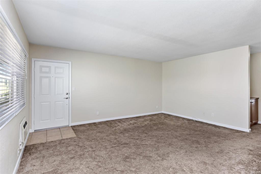 6602 Beadnell Way, Unit 26 San Diego, CA 92117 - Photo 11 of 25 an empty room with windows