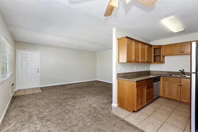 a kitchen with stainless steel appliances granite countertop a stove and a sink