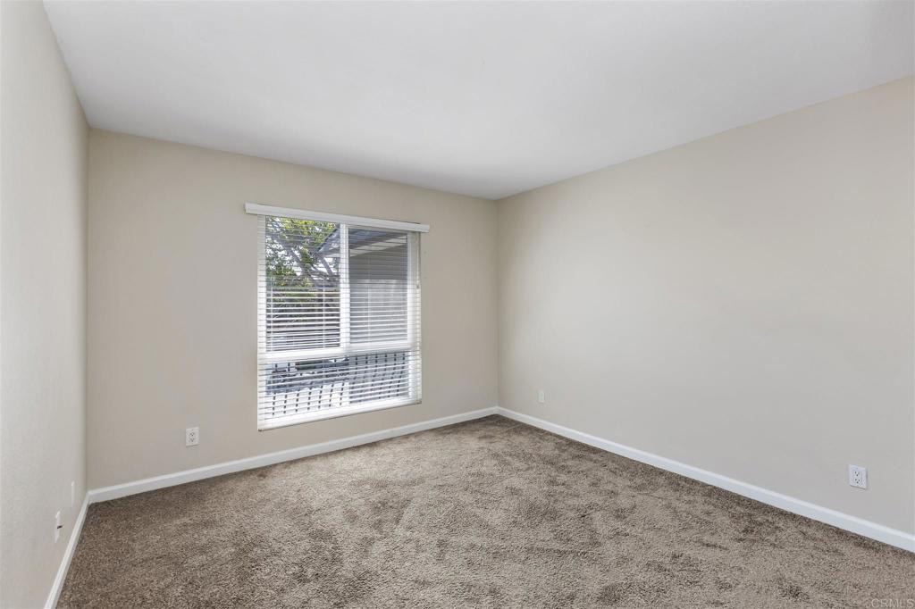 6602 Beadnell Way, Unit 26 San Diego, CA 92117 - Photo 16 of 25 an empty room with a window