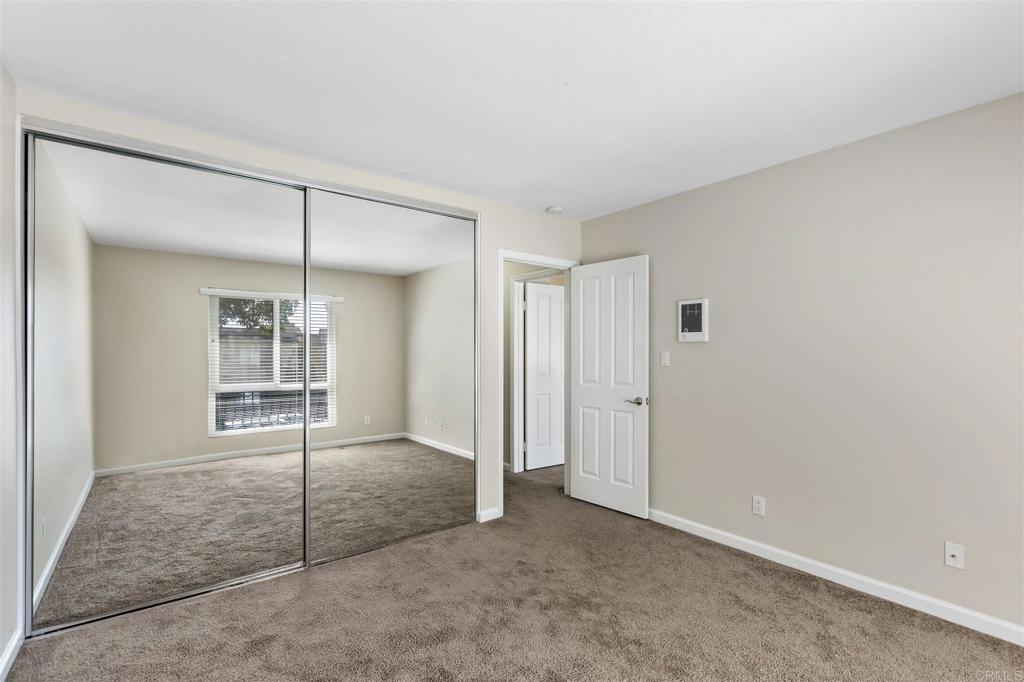 6602 Beadnell Way, Unit 26 San Diego, CA 92117 - Photo 17 of 25 an empty room with a glass door and shower