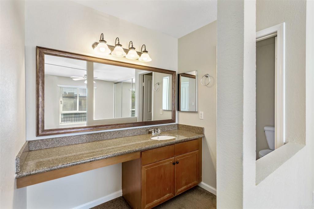 6602 Beadnell Way, Unit 26 San Diego, CA 92117 - Photo 22 of 25 a bathroom with a sink and a mirror