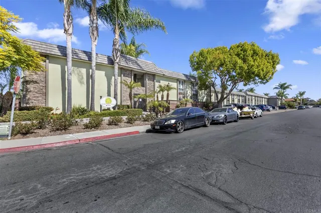 a view of a car park in front of a house