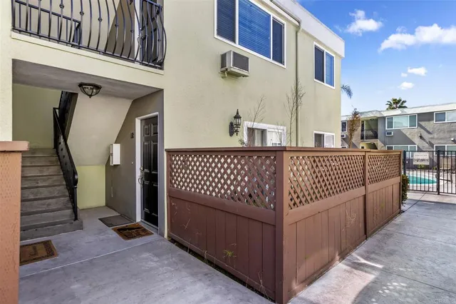 a view of a balcony with wooden fence