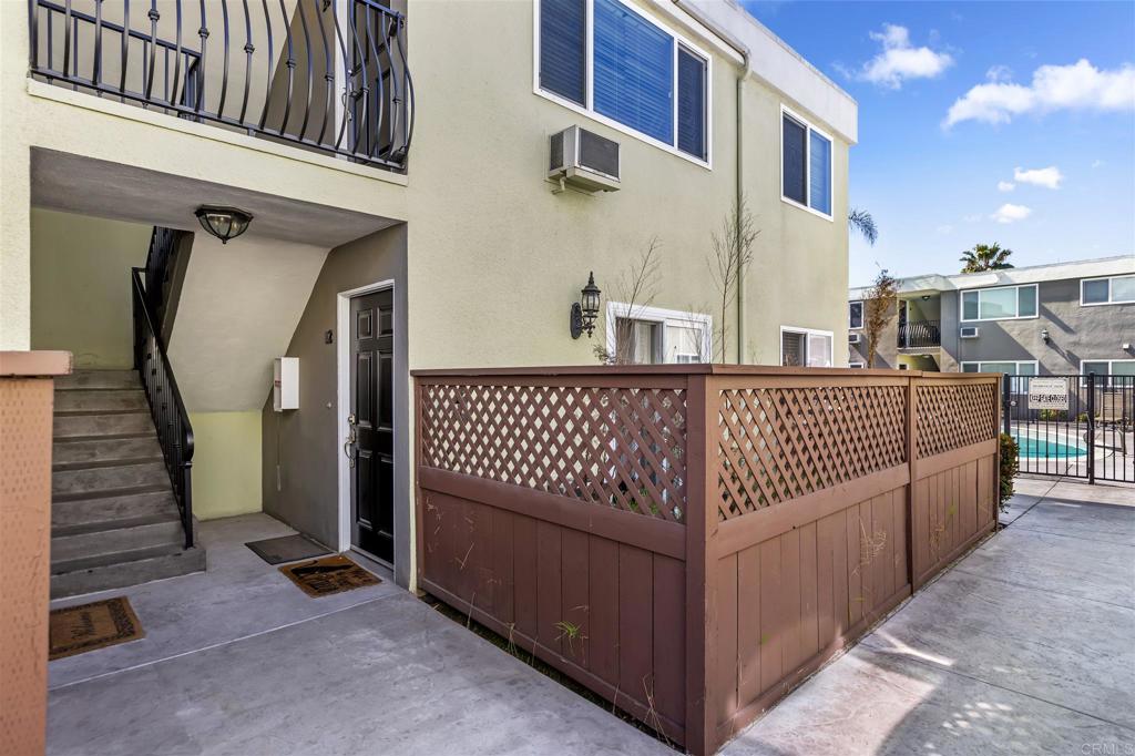 6602 Beadnell Way, Unit 26 San Diego, CA 92117 - Photo 7 of 25 a view of a balcony with wooden fence