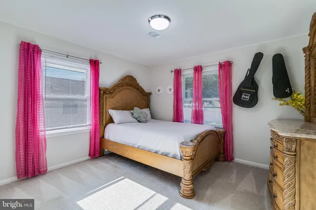 a bedroom with a bed and dresser